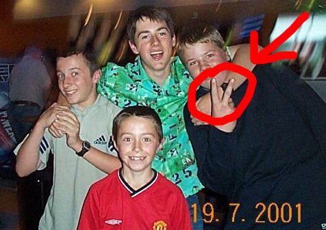 Someone sticking the V's up to a camera